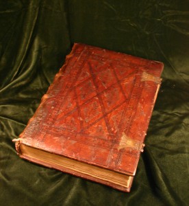 Shows fifteenth century leather tooled binding with copper clasps