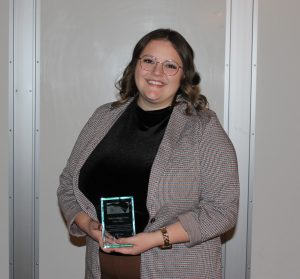 Jill Kline, librarian, is shown with Outstanding New Librarian award