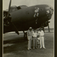Photograph of V. T. Hamlin with bomber.